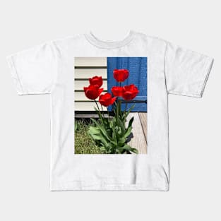 Red Tulips in front of a Blue Door Kids T-Shirt
